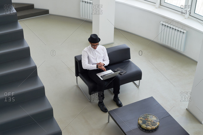 High angle view of man using a laptop
