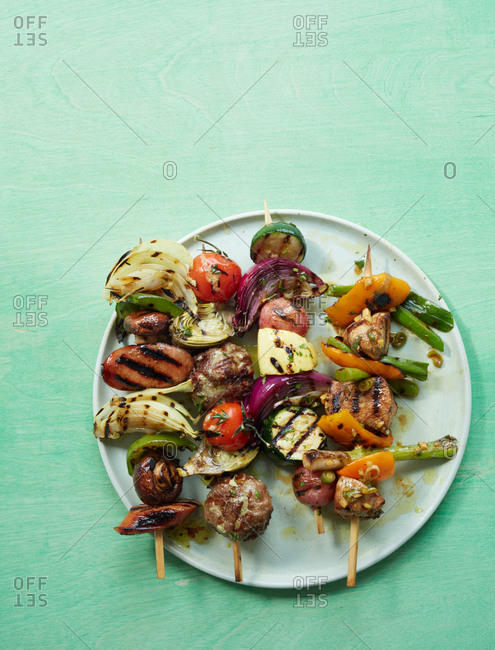 Variety of grilled kebobs on a plate