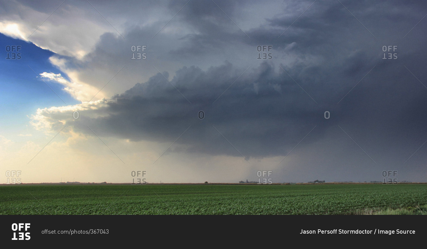 A rotating supercell thunderstorm produces a striated updraft with funnel at its base, Lexington, Nebraska, USA