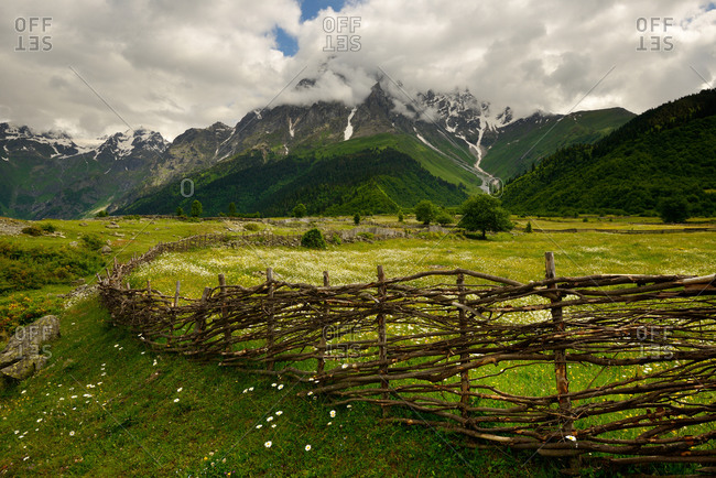Hand woven fence and distant mountains, Mazeri village, Svaneti, Georgia
