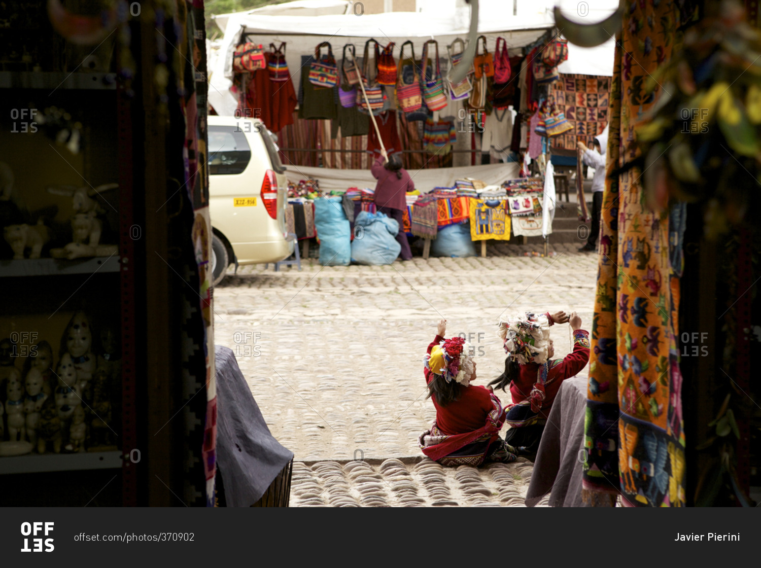 Two little girls in traditional dress at Pisac Market, Cusco, Peru