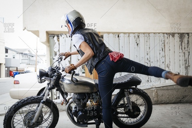 Woman preparing to ride a motorcycle