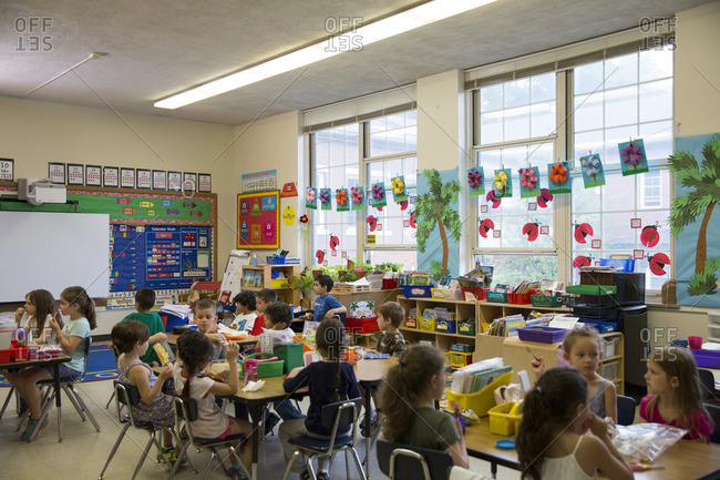 Young children eating snack in elementary classroom
