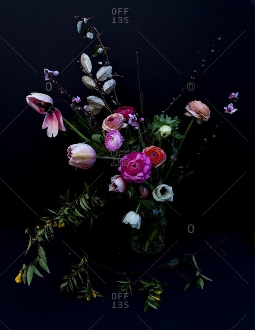 Bouquet of colorful flowers on a black seamless background