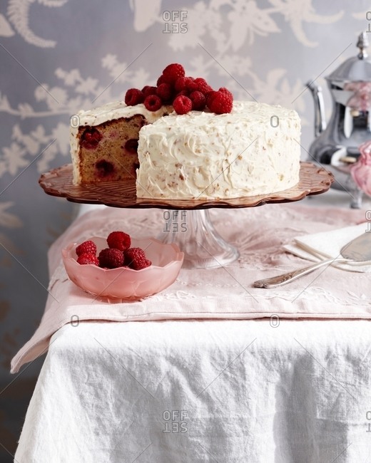 Raspberry hazelnut cake on traditional tea table