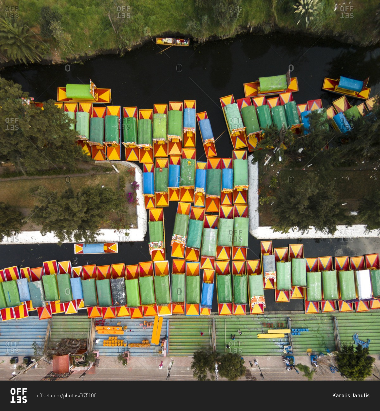 Colorful trajineras boats floating in a canal in Xochimilco, Mexico City