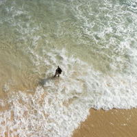 Photographer taking pictures of the surfers