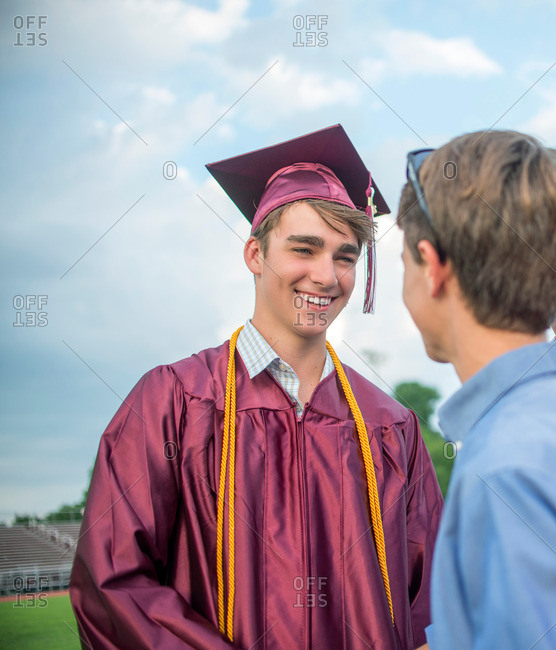 Hispanic male graduate poses with family and friends after graduation  ceremony for KIPP Academy high school in Houston, Texas Stock Photo - Alamy