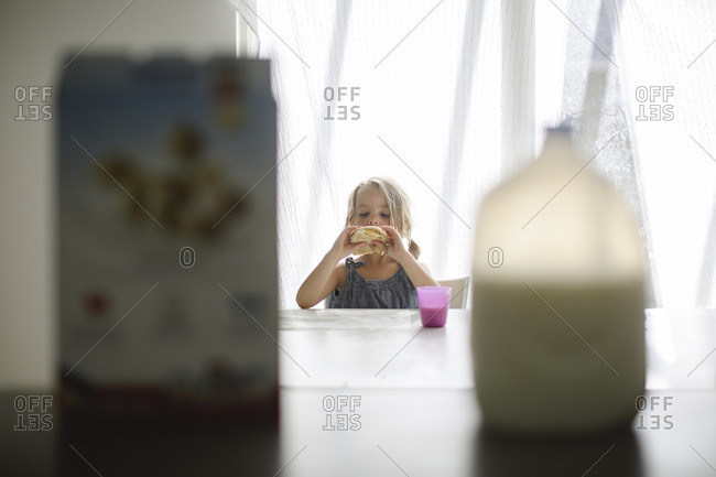 Girl eating breakfast - Offset Collection