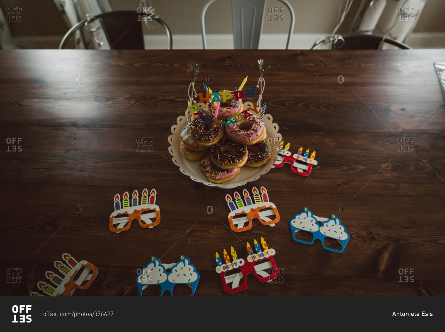 Party glasses by a donut birthday platter