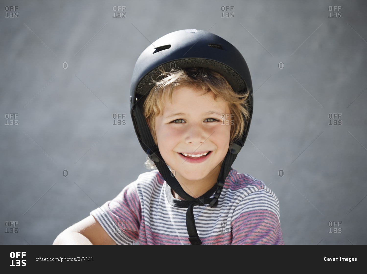 Portrait of happy boy at skateboard park
