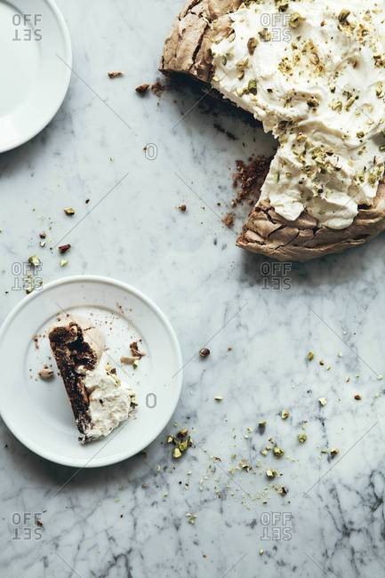 Slice of pavlova on marble background