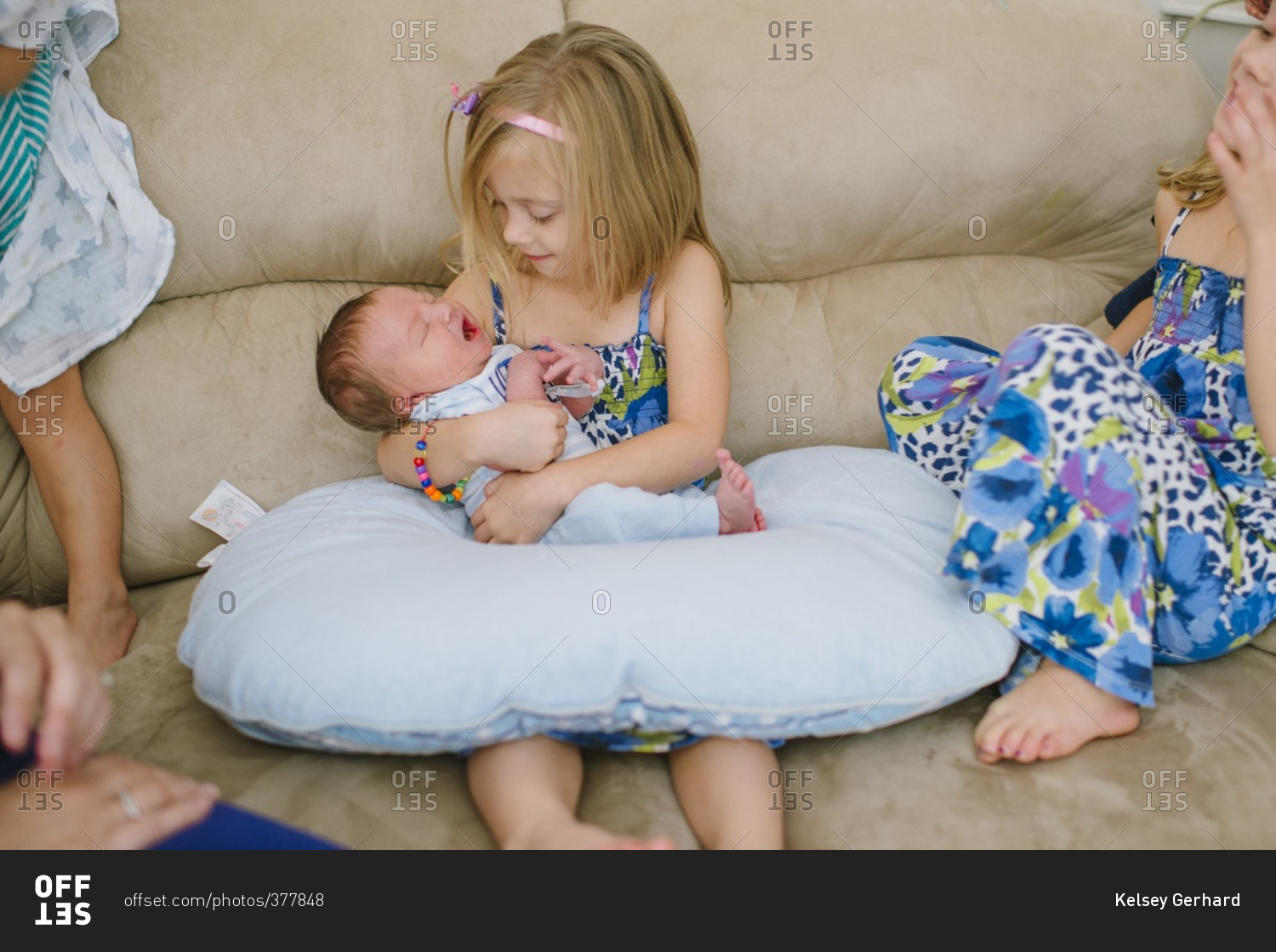 Little Girl Holding Newborn Baby Stock Photo - Offset