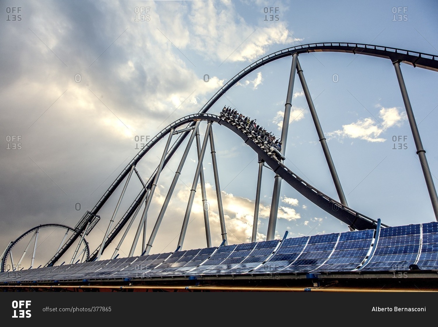 Solar powered roller coaster in an amusement park stock photo - OFFSET