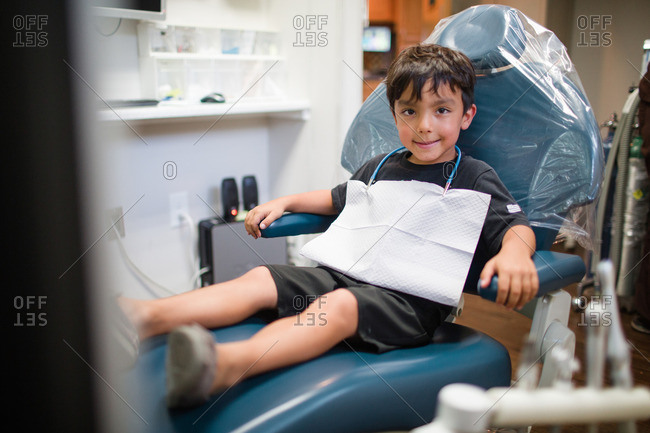 Young boy sitting in a dental chair