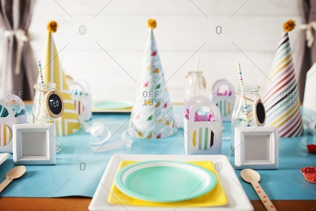 Party hats on decorated table during birthday party