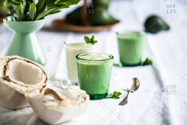 Coconut avocado smoothie on a white table