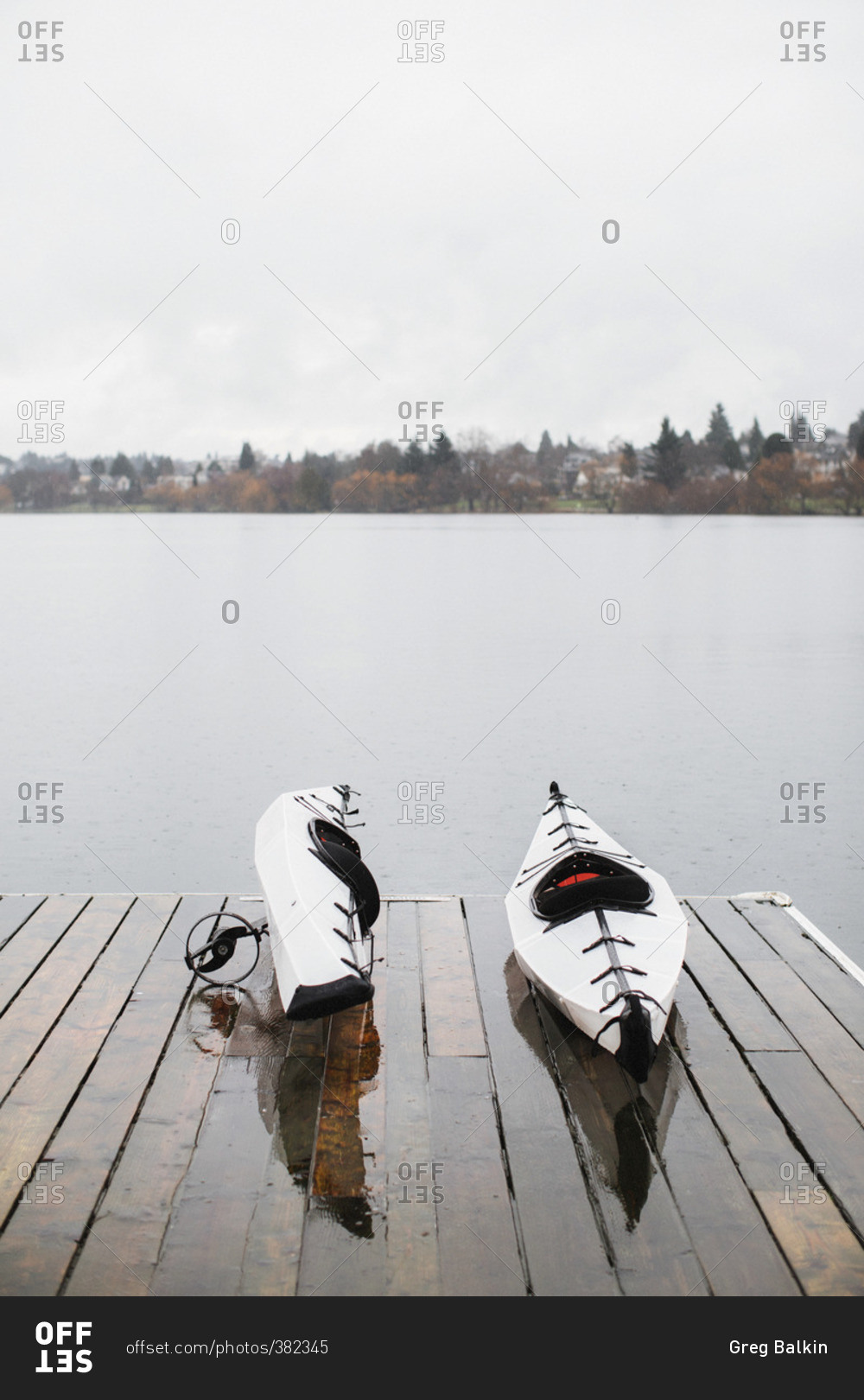 Kayaks on a lake dock