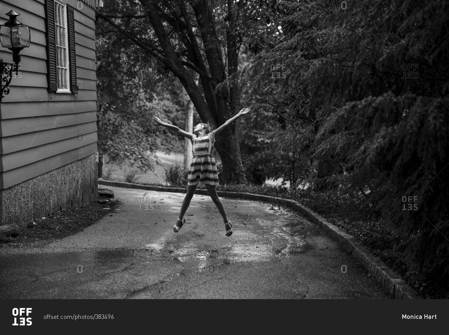 Girl dancing and playing in the rain