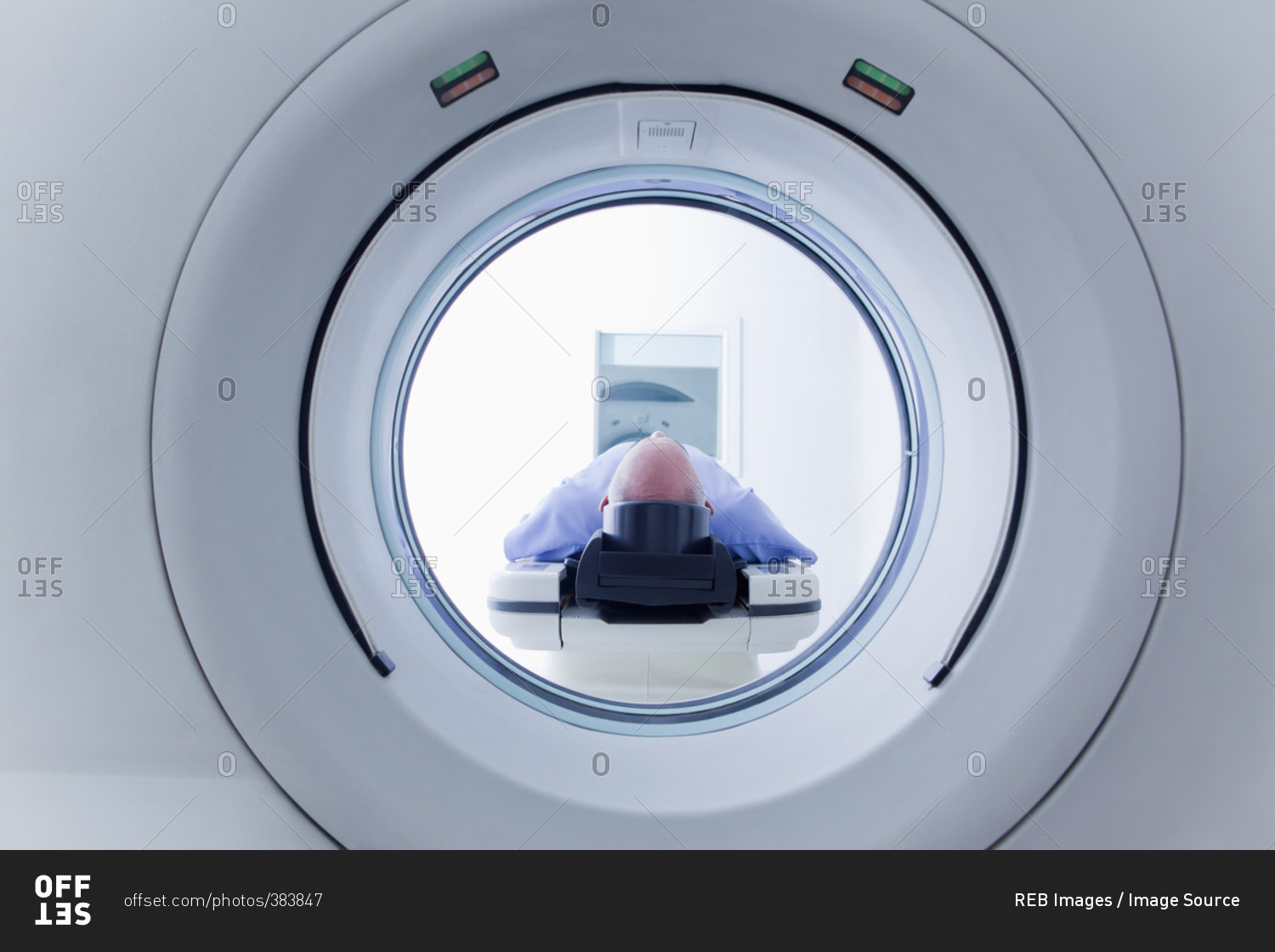 Patient lying down on CT scanner