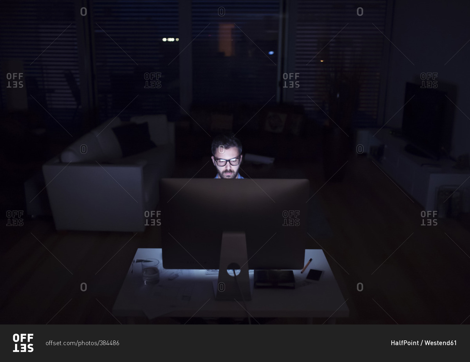 Man working at night using computer