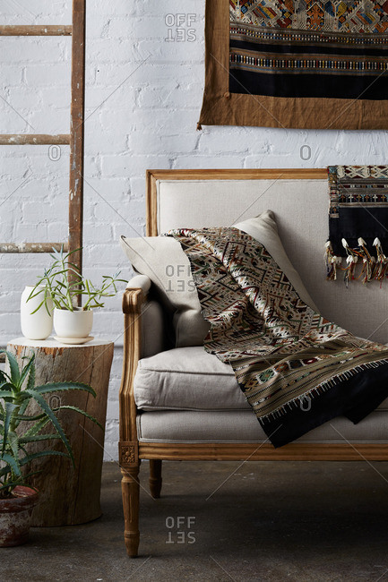 Living room interior with couch and hand woven blankets