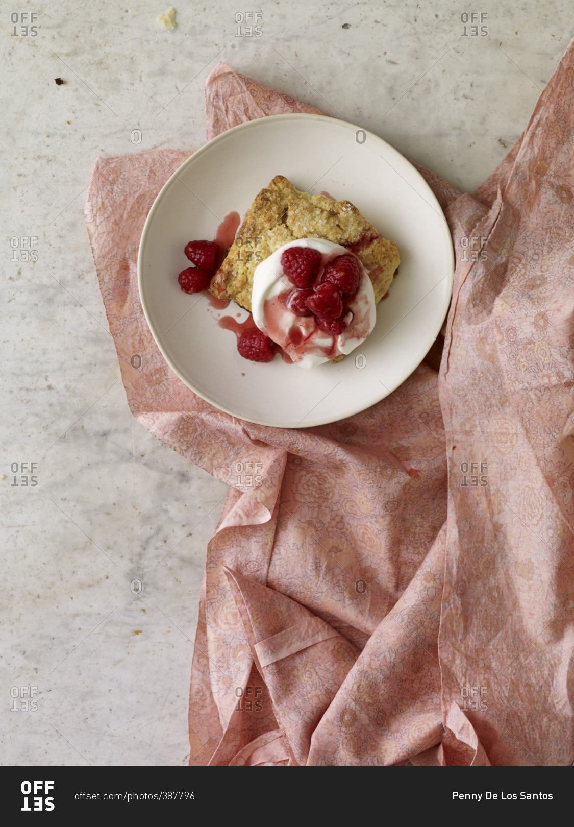 Strawberry shortcake on a plate and a pink floral cloth