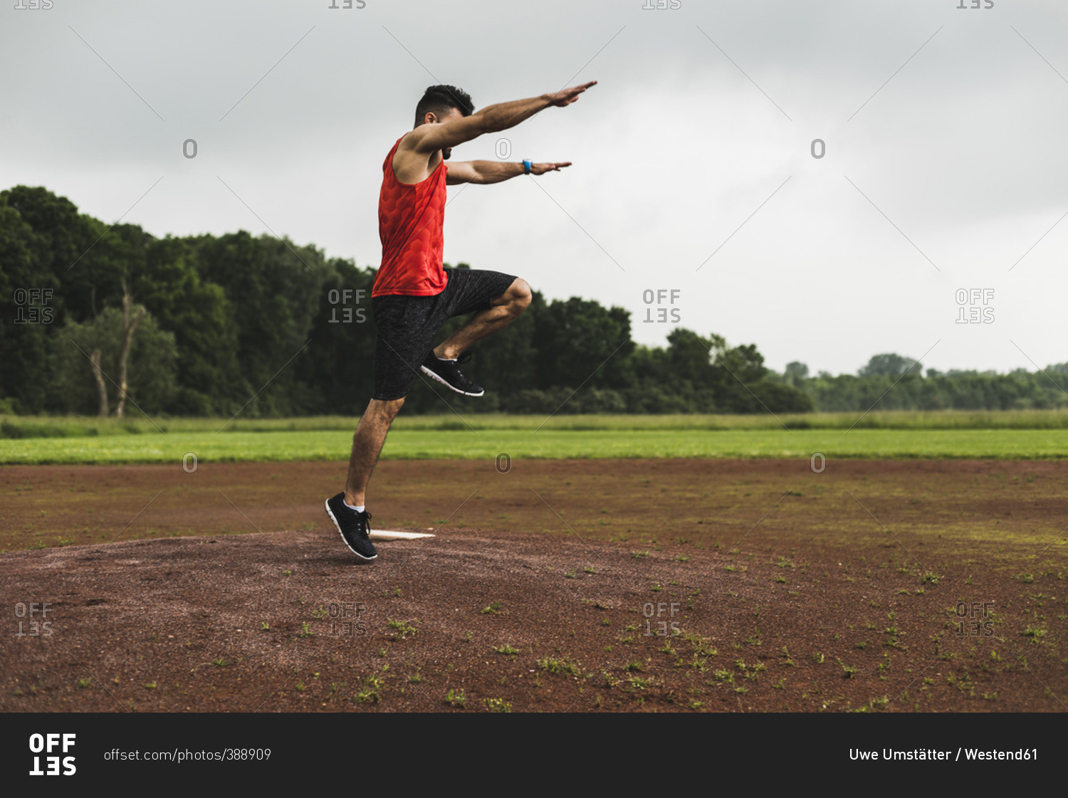 Athlete jumping on sports field