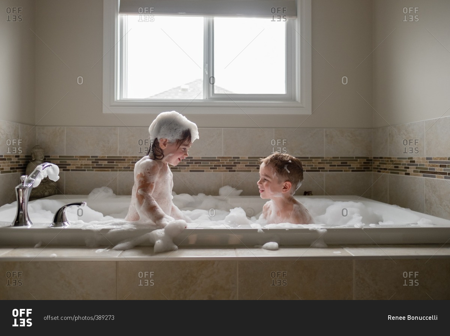 Siblings Play Together In Bubble Bath Stock Photo Offset