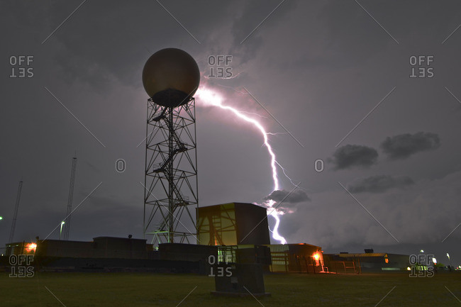 Lightning by a weather radar dome stock photo - OFFSET