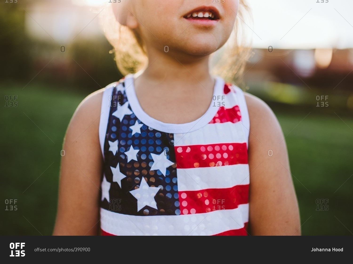 Little girl wearing American flag tank top