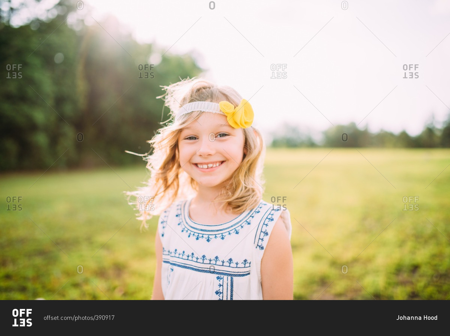 Portrait of girl wearing headband with yellow flower