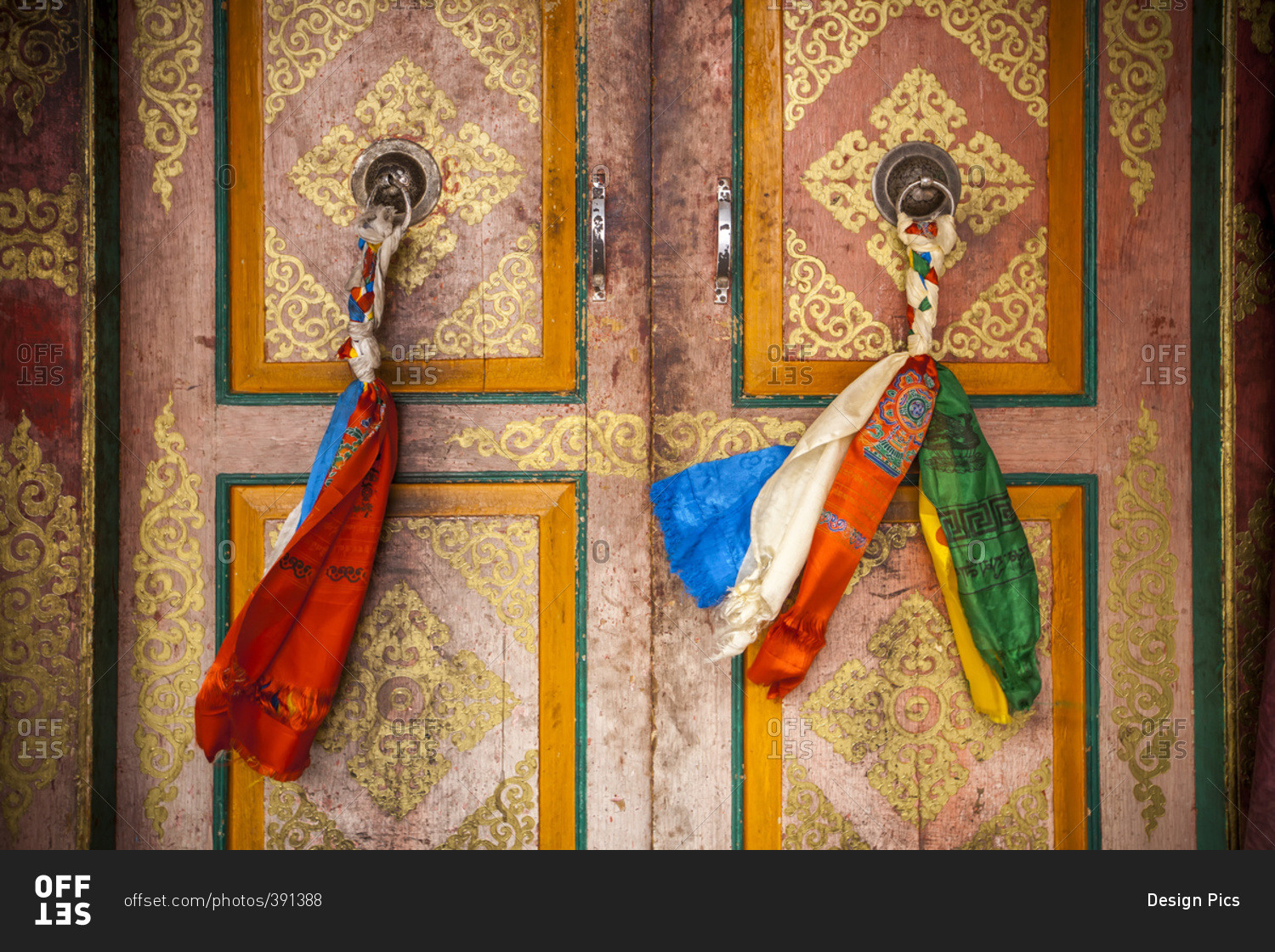 Cloth is braided together to create a decorated door pull on the doors on a Tibetan style monastery