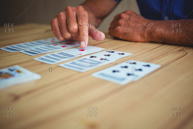 Close-up of hand pointing at a card