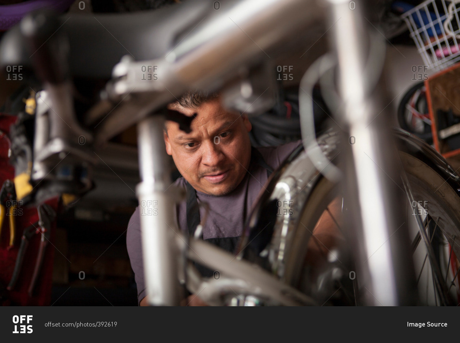 Mechanic at work in bicycle shop