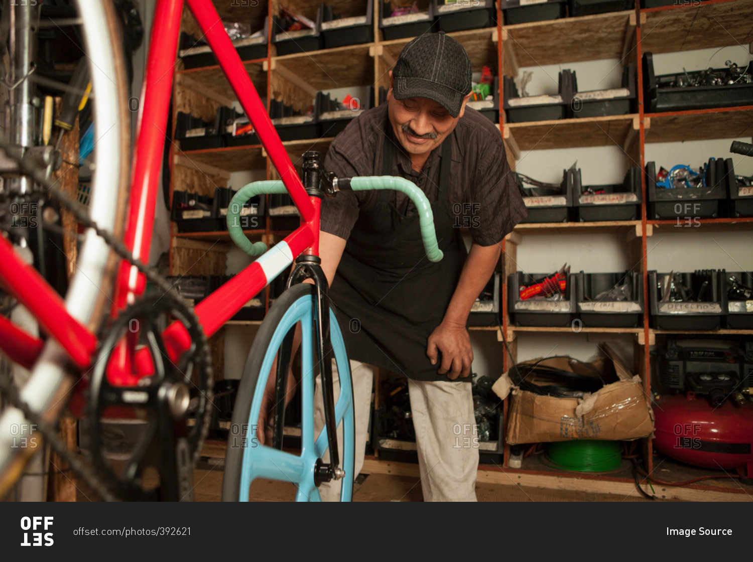 Mechanic fixing tire in a bicycle shop