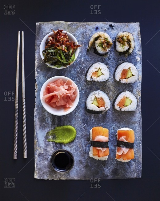 Assortment of sushi roll set on a black tray. Japanese food. Top