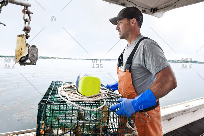 Lobsterman readies traps to go back in water in Casco Bay