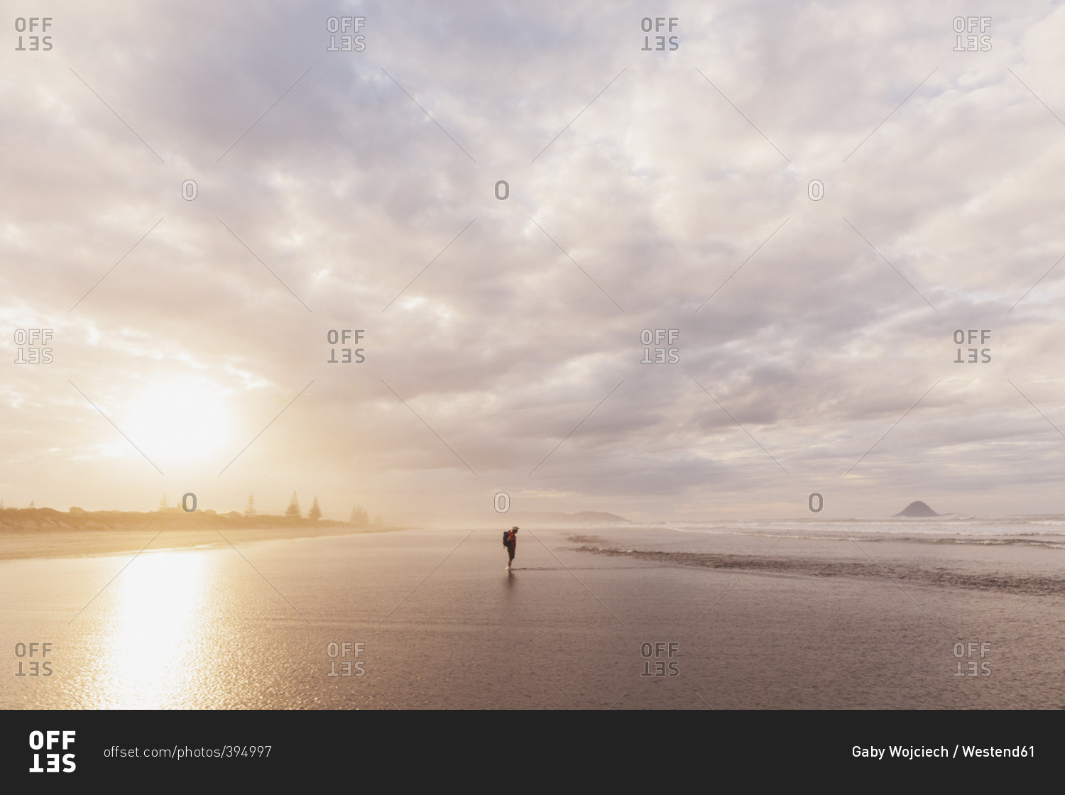 New Zealand- North Island- Bay of Plenty- Ohope Beach- man watching ocean waves- South Pacific Ocean