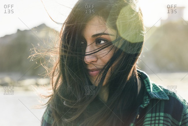 Portrait of Hispanic woman on beach