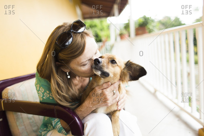 Woman being loving to her dog