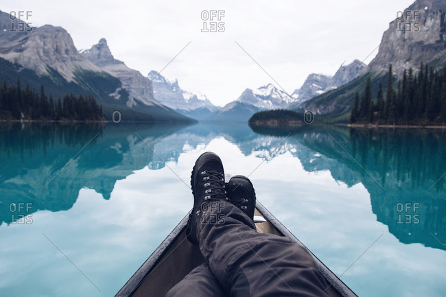 Legs in kayak on mountain lake