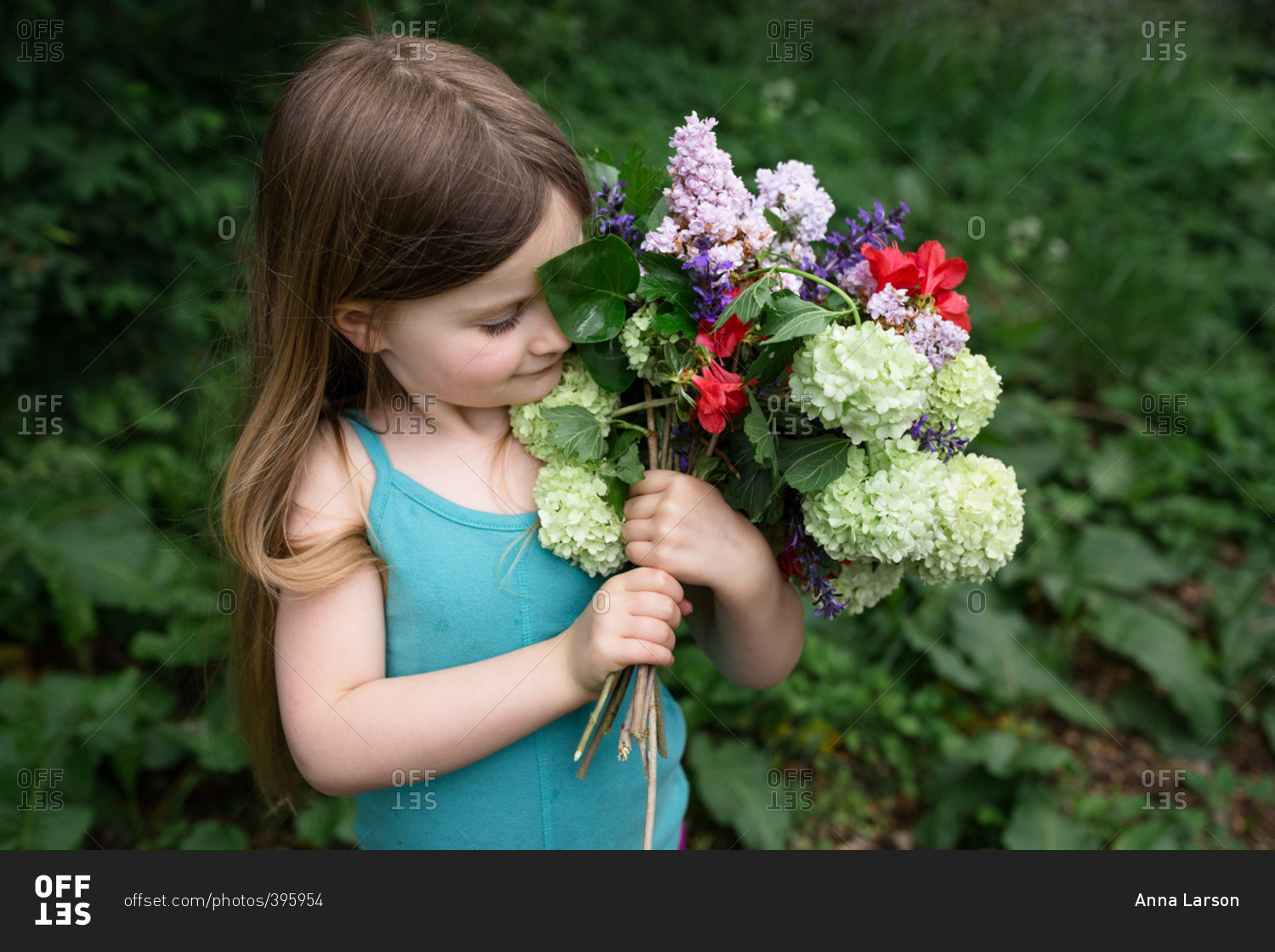 Girl holding summer flowers