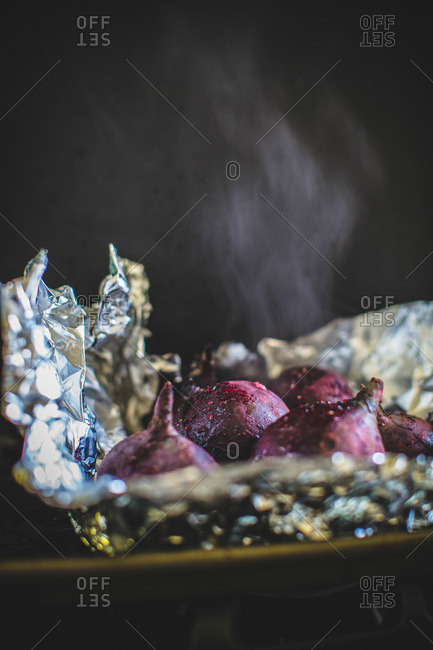Roasted beets steaming in pan