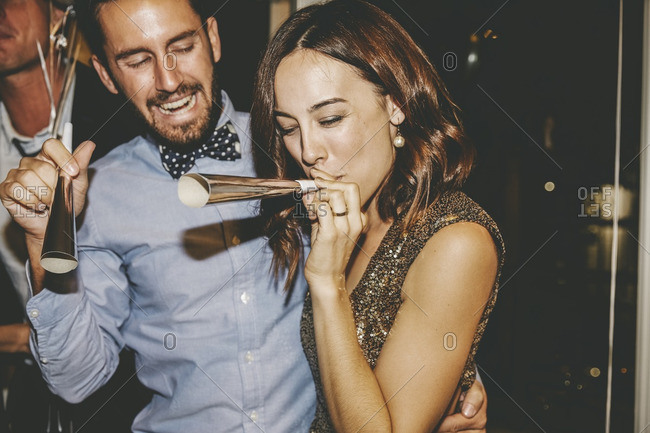 Couple with horns at a party