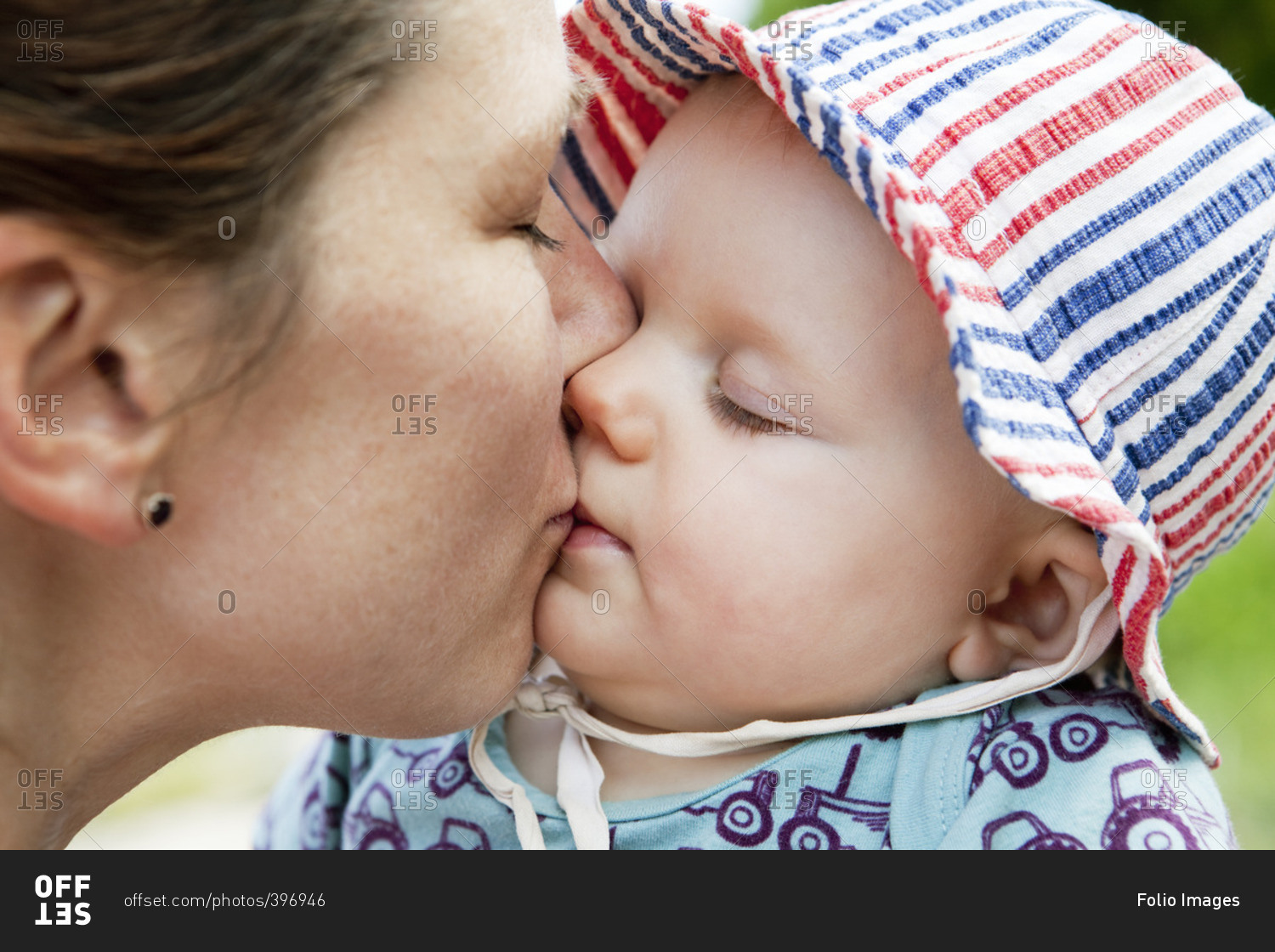 Sweden, Bohuslan, Woman kissing her baby daughter