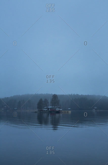 Sweden, Medelpad, Juniskar, View of riverbank in fog