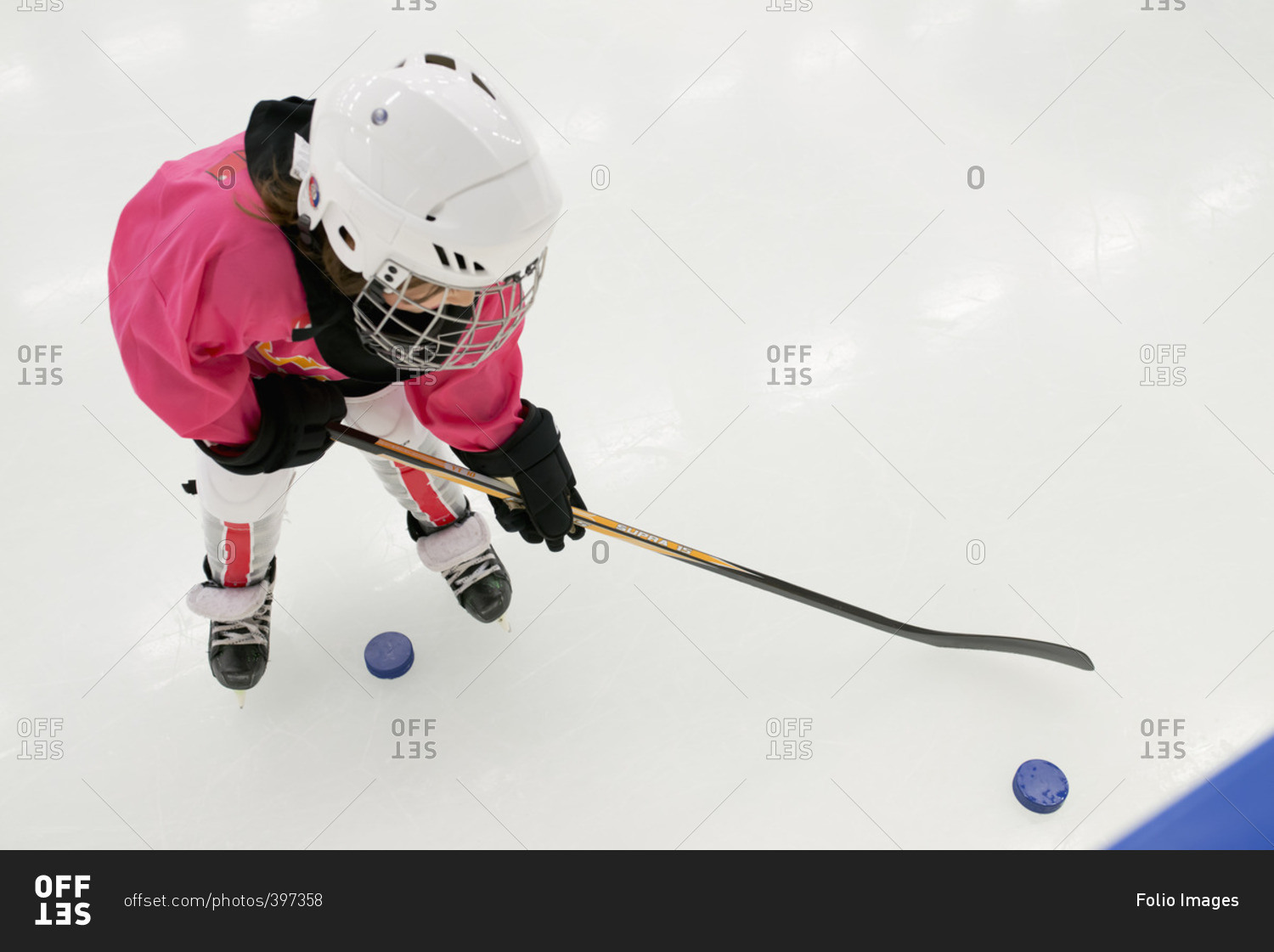 Sweden, Girl training on ice hockey rink
