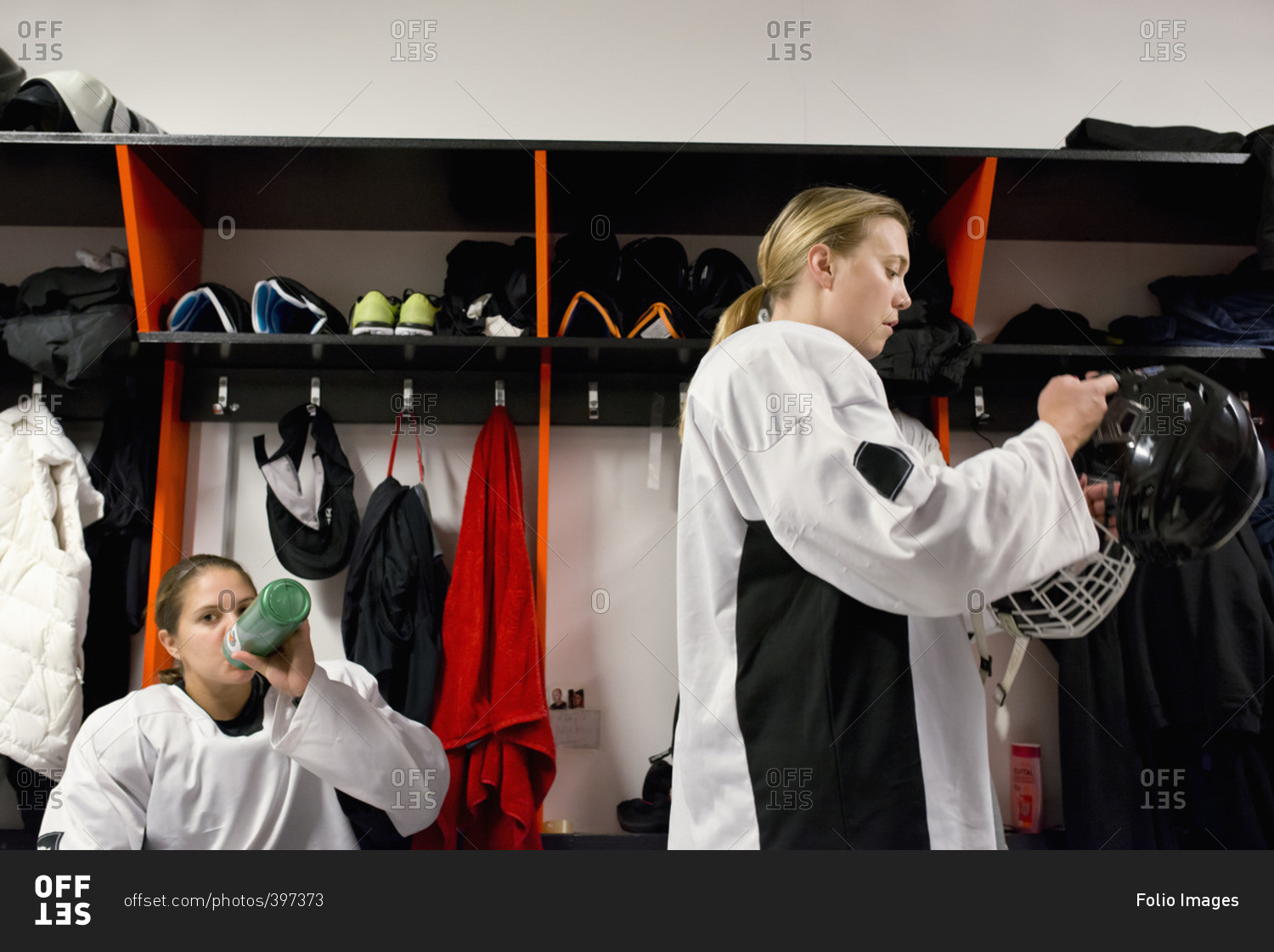 Sweden, Two young hockey players getting ready in locker room