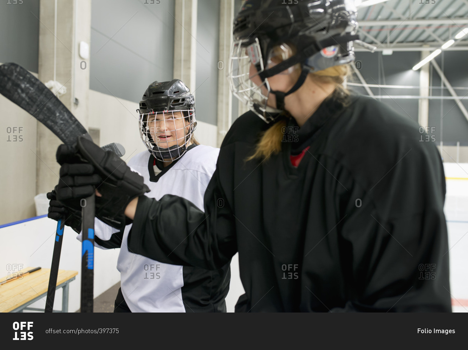 Sweden, Two young hockey players by ice rink